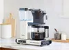 A coffee maker is shown on a kitchen counter. Produktbild-Vorschau