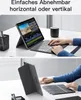 A person using a tablet with a keyboard case in a home or office setting. Produktbild-Vorschau
