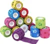 A pile of colorful self-adhesive bandages with paw print patterns. Produktbild-Vorschau