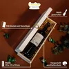 A wooden wine box with a bottle of wine inside, surrounded by decorative elements and text overlays. Produktbild-Vorschau