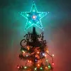 A close-up of a Christmas tree topper star with colorful lights and a 'Merry Christmas' decoration. Produktbild-Vorschau