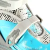 A close-up view of a blue and gray rollerblade/ice skate with a buckle and patterned fabric. Anteprima dell’immagine prodotto