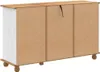 The back view of a white and wood dresser with visible particle board. Voir les images du produit