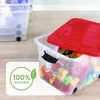 Two transparent storage boxes filled with colorful toys, one with a red lid. Produktbild-Vorschau