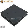 Two dark gray composite panels are stacked, with the top panel partially peeled back to reveal a protective film. Produktbild-Vorschau