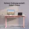 A pink standing desk with a monitor, laptop, and accessories, showcasing cable management. Voir les images du produit