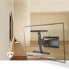 A TV wall mount is shown in a transparent overlay, demonstrating its functionality in a living room setting with a TV mounted on the wall and a wooden console table below. Produktbild-Vorschau