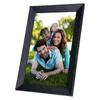 A family is posing for a photo in a digital picture frame, lying on grass outdoors. Produktbild-Vorschau