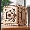 A wooden 3D puzzle safe is displayed on a wooden surface. Produktbild-Vorschau