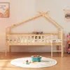 A children's house bed with string lights and stuffed animals on a rug with toys. Voir les images du produit