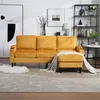 A yellow sectional sofa with an ottoman is shown in a living room setting. Náhled obrázku produktu