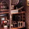 A detailed view of a miniature, multi-level library or study scene, likely a DIY book nook kit, with intricate wooden furniture, bookshelves filled with tiny books, a telescope, and decorative elements. Náhľad obrázku produktu