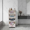 A white multi-tiered storage unit with wheels, filled with folded clothes and towels, is placed in a modern bathroom with marble-patterned walls. Náhled obrázku produktu