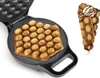 A waffle maker with a waffle inside and a finished waffle cone on the side. Produktbild-Vorschau