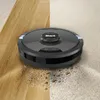 A robot vacuum cleaner is shown on a split surface of hardwood floor and carpet, demonstrating its cleaning capability by picking up debris. Produktbild-Vorschau