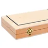 A close-up, angled view of a closed wooden box with a brass latch. Produktbild-Vorschau