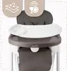 A close-up view of a baby high chair with a tray and seat. Voir les images du produit