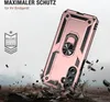 A rose gold phone case with a ring stand is shown at an angle, with debris falling around it to simulate a drop. Produktbild-Vorschau