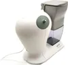A white electric grater with a gray hopper and a clear plastic container for grated food. Anteprima dell’immagine prodotto