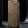 A close-up side view of a khaki-colored flip-style phone case for a Motorola Moto G85, shown against a dark background. Produktbild-Vorschau
