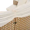 A close-up view of a beige and white outdoor lounge set, showing the woven texture and fabric details. Voir les images du produit