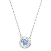 A silver necklace with a circular pendant containing a blue stone and clear crystals. Produktbild-Vorschau
