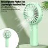 A mint green handheld fan is shown in the foreground, with a smaller inset image of the same fan on the left. The background is a soft, out-of-focus green. Produktbild-Vorschau