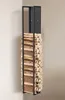 A tall, narrow metal firewood rack filled with logs, standing in a corner against a light-colored wall. Náhľad obrázku produktu