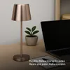 A copper LED table lamp is placed on a wooden desk next to a laptop and a potted plant. Podgląd zdjęcia produktu