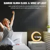A woman waking up in bed with a sunrise alarm clock on the nightstand. Produktbild-Vorschau
