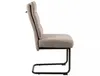 A side view of a single upholstered dining chair with a black metal frame. Voir les images du produit