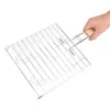A hand holding a metal grill basket. Náhled obrázku produktu
