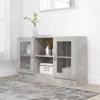A sideboard cabinet with glass doors and shelves, placed on a rug in a room with a window and a mirror. Produktbild-Vorschau