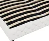 A close-up view of a white upholstered bed frame with wooden slats. Produktbild-Vorschau