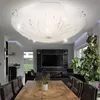 A modern living room with a dining table, chairs, and a large television. Anteprima dell’immagine prodotto