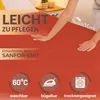 A person's hands are shown on a red surface, with text overlays and icons indicating product features. Produktbild-Vorschau