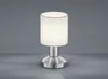 A modern table lamp with a white fabric shade and a brushed metal base, set against a plain gray background. Produktbild-Vorschau