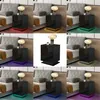 A collage of images showing a black nightstand with LED lighting in various colors next to a bed. Produktbild-Vorschau