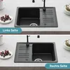 Two images of a black granite kitchen sink, one showing the left-side installation and the other showing the right-side installation, placed on a countertop. Produktbild-Vorschau