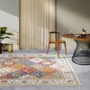 A dining area with a rug, table, and chair. Voir les images du produit