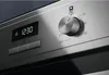 A close-up view of the control panel of a stainless steel oven, showing a digital display and a temperature control dial. Náhľad obrázku produktu
