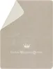 A beige blanket with a corner folded back, revealing a lighter inner side. Text and graphics are printed on the blanket. Produktbild-Vorschau