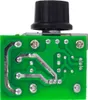 The back of a green circuit board with a black knob on top, viewed from a top-down angle. Voir les images du produit
