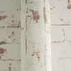 A close-up view of textured wallpaper with a brick pattern. Produktbild-Vorschau