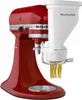 A red KitchenAid stand mixer with a white pasta maker attachment, extruding pasta. Náhled obrázku produktu