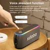 A hand is shown interacting with a portable speaker, demonstrating its voice assistant function. Produktbild-Vorschau