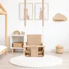 A baby swing is set up in a nursery or play area, with decorative items on the wall and a rug on the floor. Anteprima dell’immagine prodotto