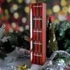 An advent calendar with 25 mini-books is displayed amongst Christmas decorations. Náhled obrázku produktu