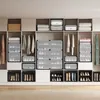 A well-organized closet with multiple storage units for shoes and folded clothes. Produktbild-Vorschau