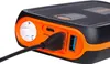 Close-up of a black and orange power bank with a USB cable plugged into one of its ports. Náhled obrázku produktu